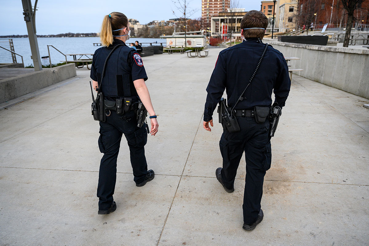 Two police officers walking through the Union terrace